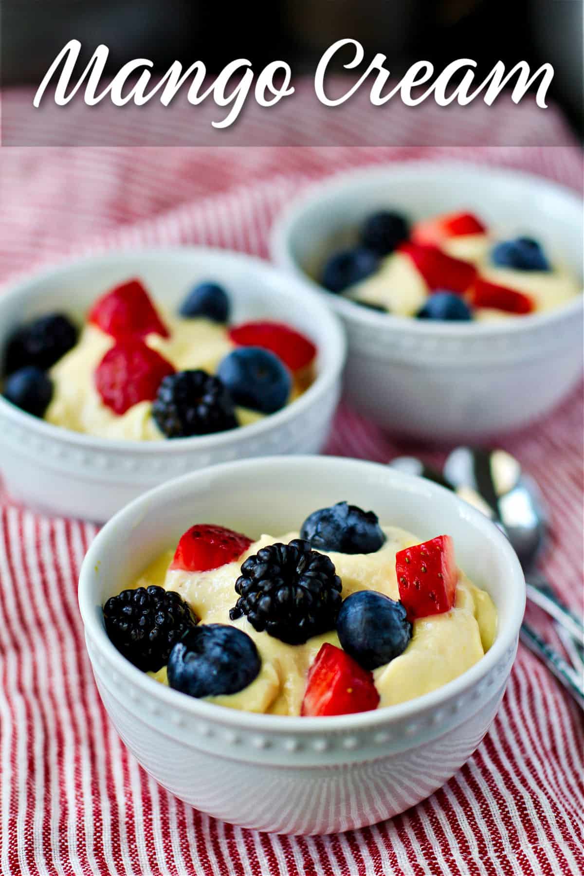 Mango Cream with blueberries, strawberries, and blackberries.