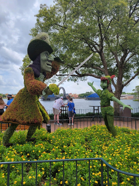 Peter Pan and Captain Hook Topiaries in World Showcase During the Epcot Flower and Garden Festival