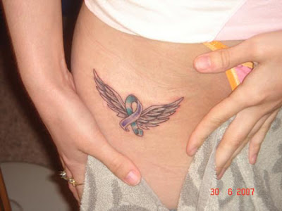 This small angel wings tattoo on the hip can be easily concealed.