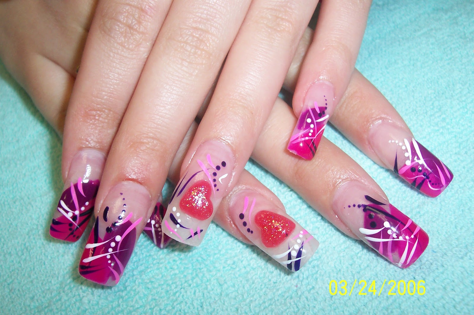great looking acrylic nail design with an attractive floral design