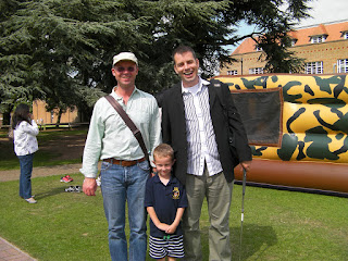 Bune and Jason by the bouncy castle and the merchant taylors school design and technology block