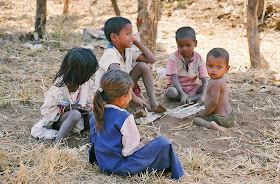 children playing with sticks in rural India