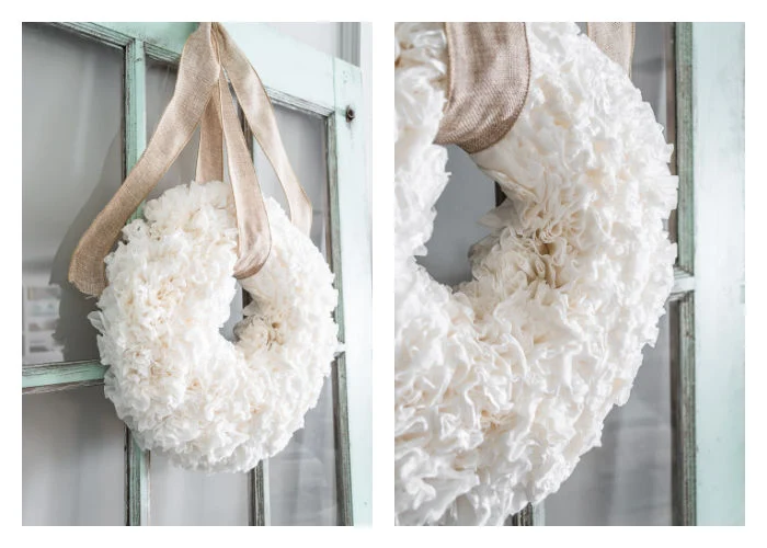 white ruffled coffee filter wreath hanging on vintage chippy door