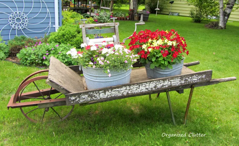 Weathered Wheelbarrow & Laundry Tub Planteres www.organizedclutterqueen.blogspot.com