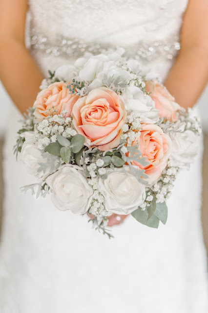 bride holding bouquet:Photo by Tom The Photographer on Unsplash