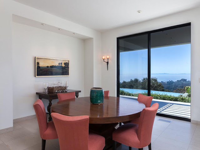 Photo of round dining table by the terrace doors