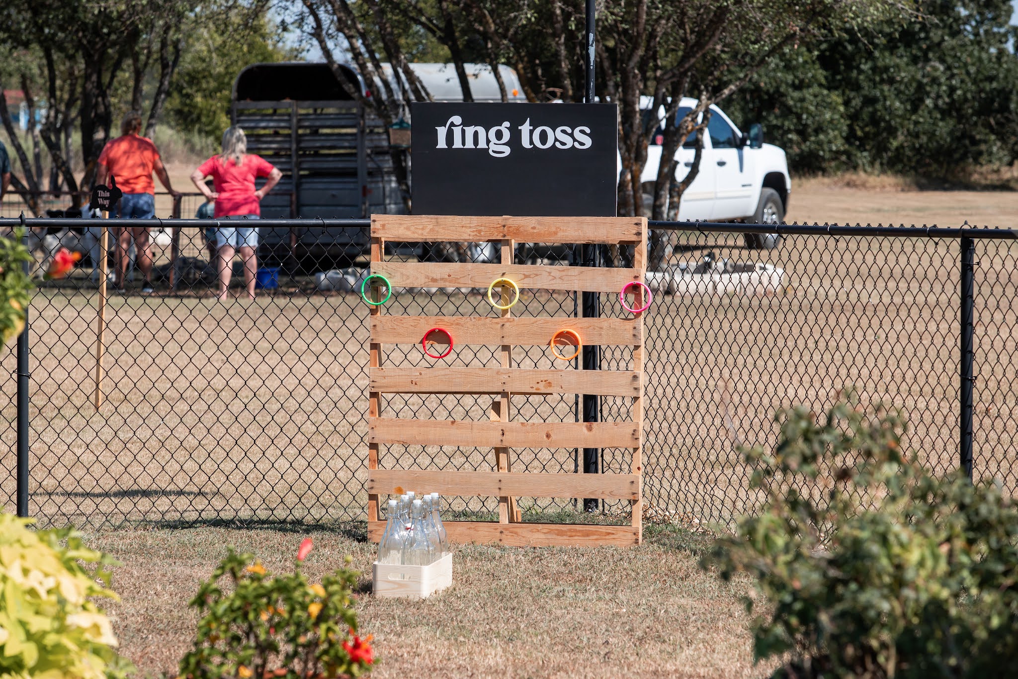 Backyard DIY ring toss game for fair themed birthday party. DIY birthday graphic for games