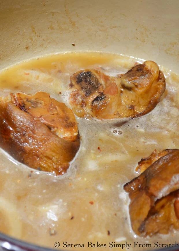 Collard Green recipe stir in chicken broth and water to ham hock from Serena Bakes Simply From Scratch.