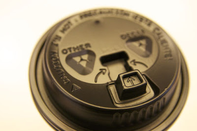 his HOT coffee cup lids at