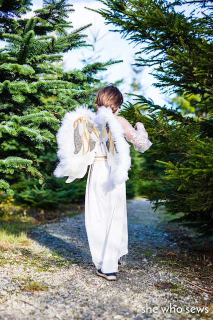 Angel costume near Christmas Trees