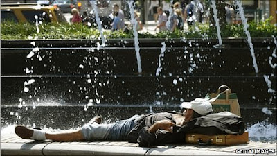 man lying in front of a fountain