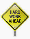 Hard work ahead sign