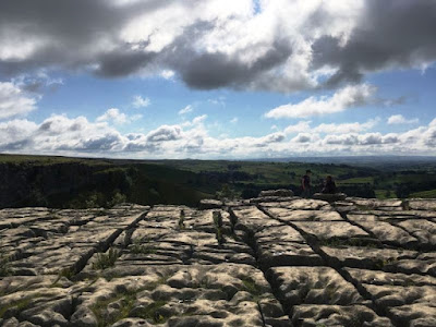 Limestone pavement and view down to the valley below