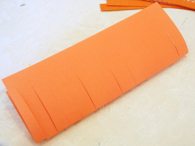 Halloween craft for kids, fine motor paper weaving jack-o-lantern