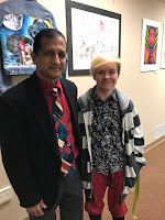 Picture of Felix with the art show judge, Azyz Sharafy.