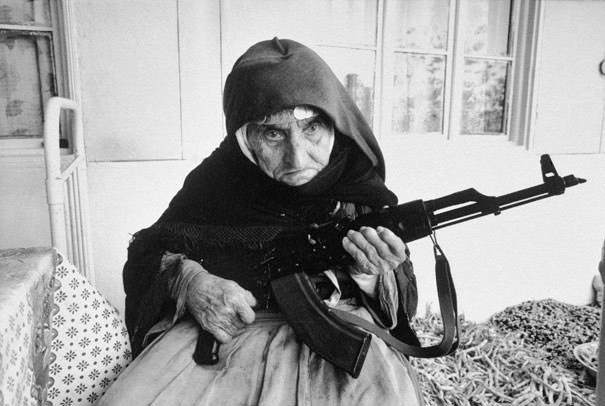 1990 old woman guarding her home with gun