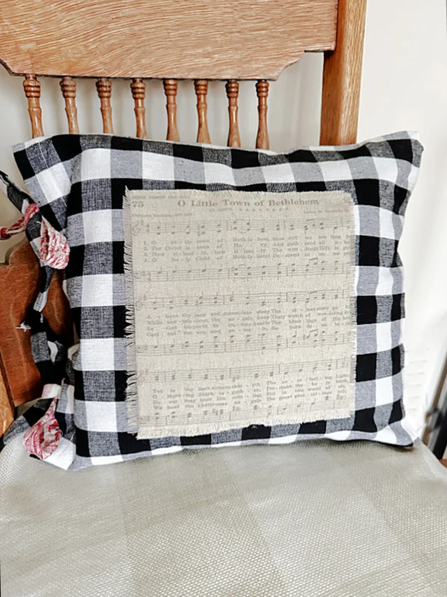 music sheet pillow on chair
