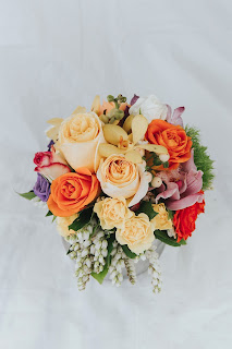 Bouquet of pastel coloured flowers on white background