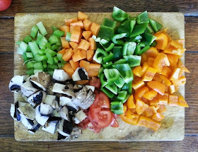 Assorted chopped vegetables on a chopping board 