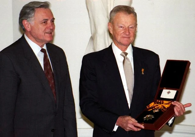 FILE PHOTO - Prominent American political scientist Zbigniew Brzezinski (R) holds the Grand Duke Gediminas medal as Lithuanian President Valdas Adamkus looks on after an awarding ceremony in Vilnius, Lithuania November 17, 1998. REUTERS/File Photo