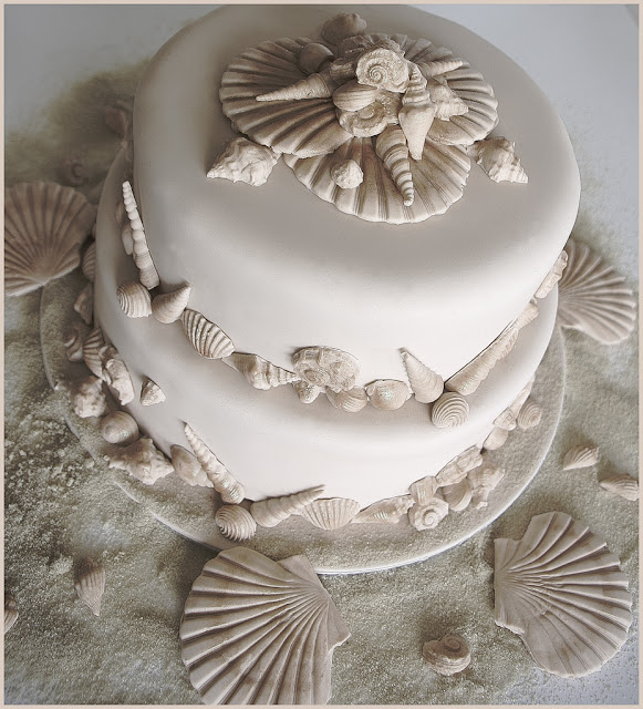 This fabulous Beach Wedding Cake is covered in ivory sugarpaste and