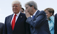 2Italian Premier Paolo Gentiloni talks to U.S. President Donald Trump during a G7 summit in Taormina, Italy, Saturday, May 27, 2017. Perhaps he’s whispering that climate change is real and withdrawing from the Paris treaty is a stupid idea. (Photograph Credit: Jonathan Ernst/AP) Click to Enlarge.