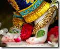 [Krishna's lotus feet]