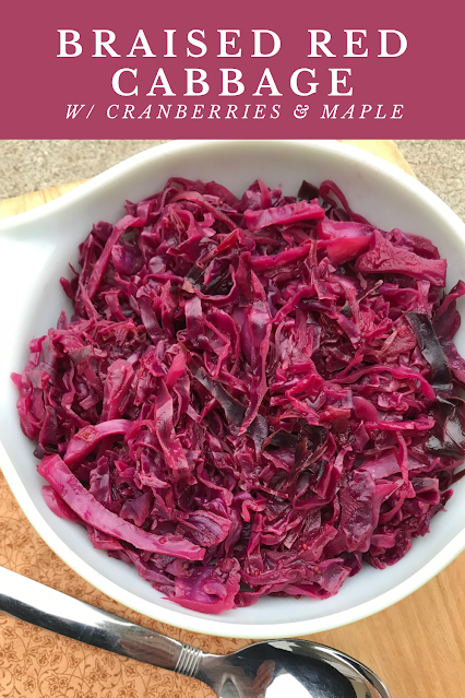 A serving bowl filled with braised red cabbage.