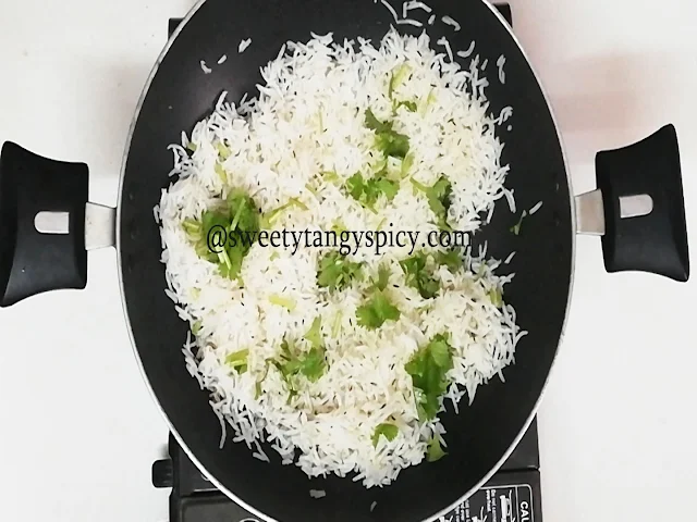Garnishing Jeera Rice with Fresh Coriander Leaves