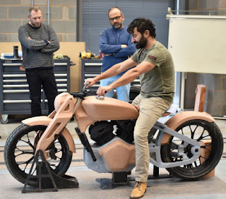 Man sits on full-size clay model of the Concept Kx.