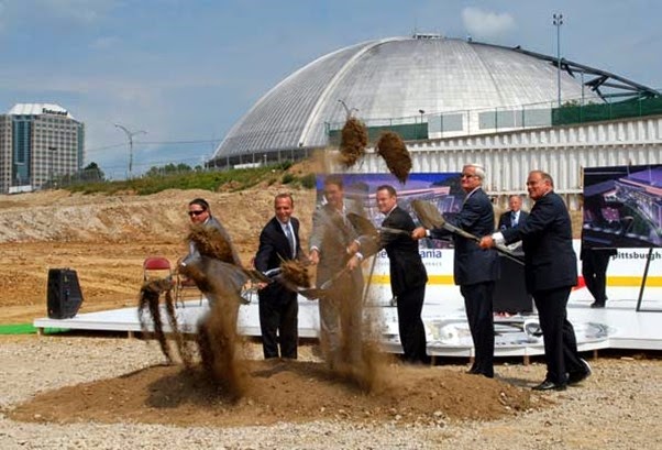 Pittsburgh Penguins team officials and elected leaders participate in the groundbreaking on a $290 multi-purpose arena that will sit along Centre Avenue in the Hill District and replace the Mellon Arena (background).

(From left) Penguins president David Morehouse, Allegheny County Chief Executive Dan Onorato, Penguins owner Mario Lemieux, Pittsburgh Mayor Luke Ravenstahl, Penguins CEO Ken Sawyer and Governor Edward G. Rendell. The ceremony took place  on Thursday, August 14.The yet-to-be-named arena is scheduled to open in time for the 2010-2011 hockey season.  James M. Kubus / Tribune-Review