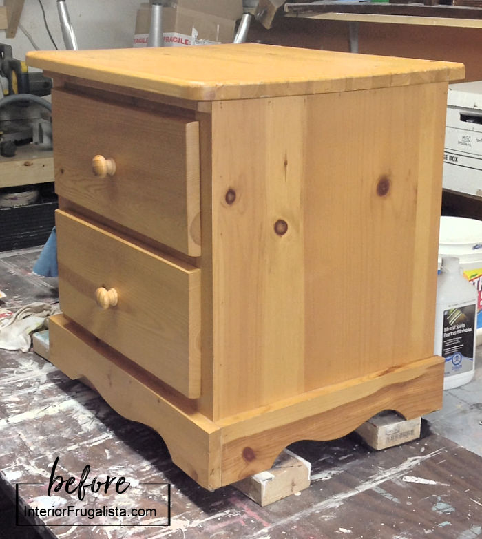 A two drawer pine bedside table before getting a makeover.