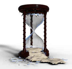 A broken hourglass with sand flowing from the bottom
