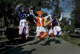 Indian school boys leap in air as they perform Bhangra