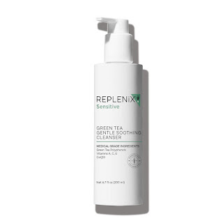 Close-up image of the Replenix Green Tea Gentle Soothing Cleanser. The bottle is sleek, tinted in a soft green shade with a white pump dispenser. The label is clearly visible, featuring elegant typography and green tea leaves graphic, emphasizing the cleanser's main ingredient.