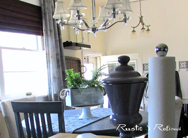 Home Tour of an updated kitchen with ebony stained cabinetry, an eat-in kitchen table and functional butlers pantry.
