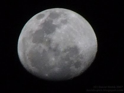 nearly full moon close up photo of the moon - craters, spots, markings, man on the moon!