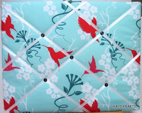 French ribbon memory board with hummingbirds on turquoise background