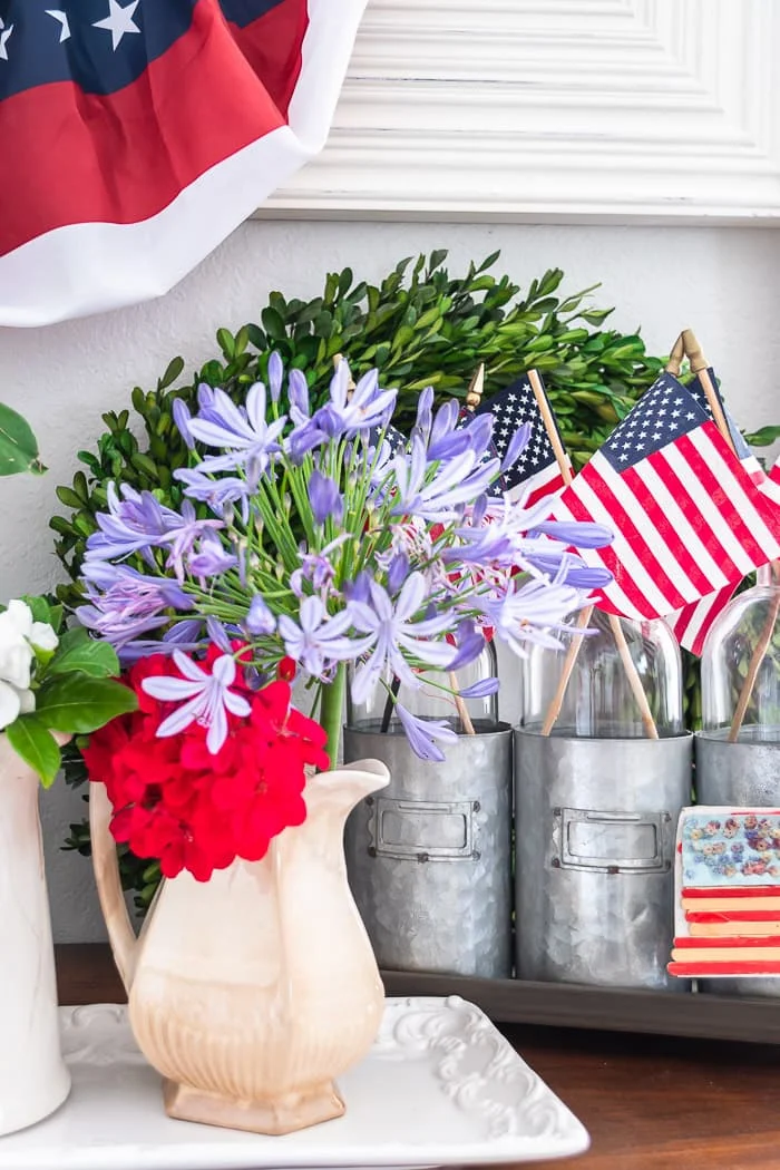 purple alium, red and white flowers in antique pitcher, vintage patriotic vignette