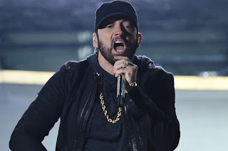 <img src="Eminem's Endorsement: The Enduring Influence of Rap Music”>