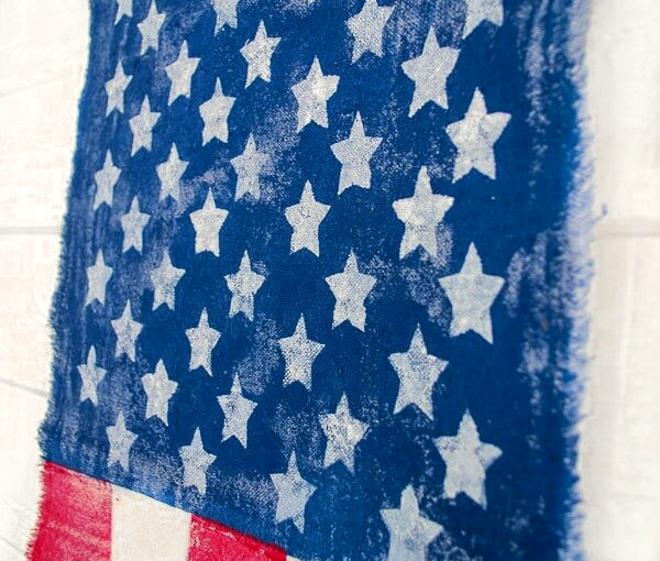 close up of stars painted on DIY flag banner