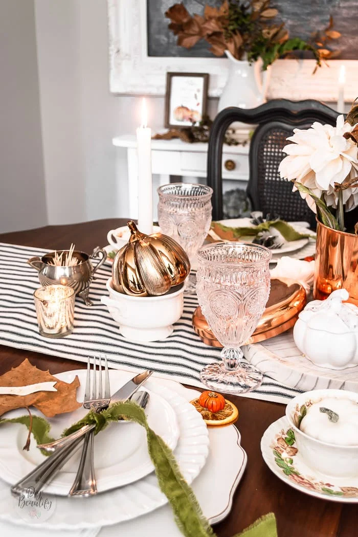 white chargers and plates, green velvet ribbon, maple leaf place cards, ironstone and fall foliage