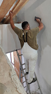 Halil continues with plastering up high