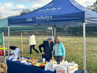 Elizabeth Jennings realtor from One Sotheby's International Realty and realtor Kate Mitchell providing breakfast to volunteers on MLK Day