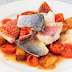 Fish with tomatoes, potatoes, and onions