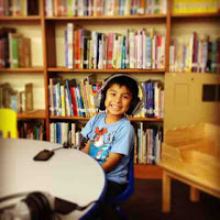 image of a boy with headphones on