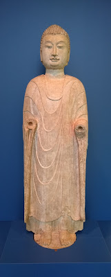 A partially damaged Buddha sculpture