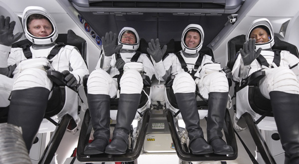 The four Crew-8 astronauts wave to the camera before Crew Dragon Endeavour's side hatch is closed for launch to the International Space Station...on March 3, 2024.