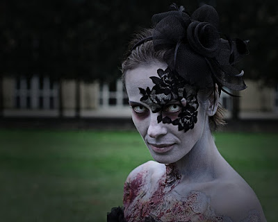 This zombie woman is wearing a lace masquerade half mask over one eye, these strapless adhesive lace masks and tattoos are reusable. They make a sexy mask for masquerade balls, boudoir photos, burlesque dancers, etc.