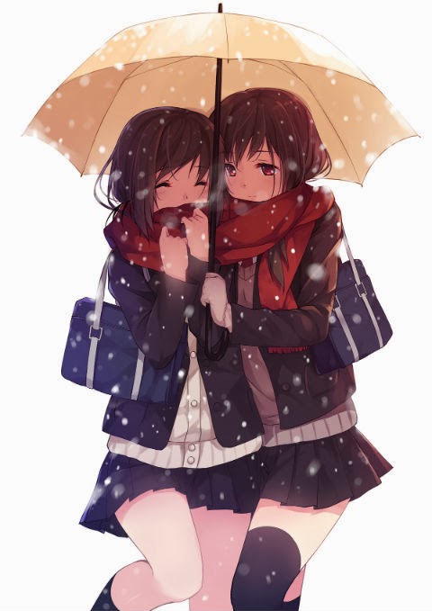 Two girls walking under an umbrella
